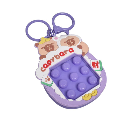 LLAVERO PLASTICO FORMA DE JUEGO AZUL MORADO DIM:7X7X1