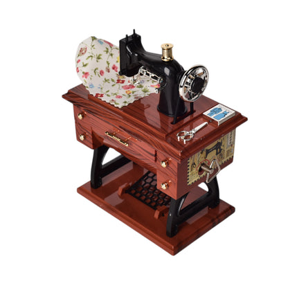CAJA MUSICAL MAQUINA DE COSER EN PLASTICO DIM:7x15x13CM