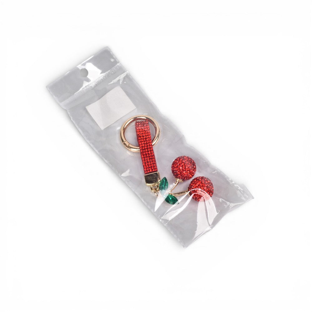 llavero resina y metal cereza dim:4x2x4