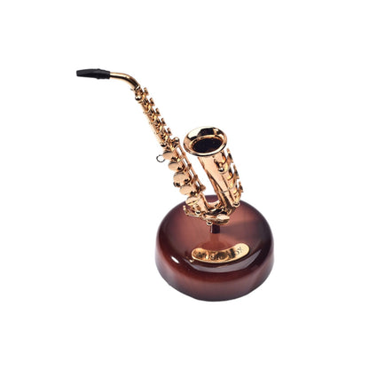 CAJA MUSICAL SAXOFON EN PLASTICO DIM:9.2*13*20CM